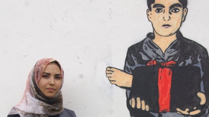 فنانة يمنية تروي قصص ضحايا الحرب"الصامتين"على حوائط صنعاء(صور)