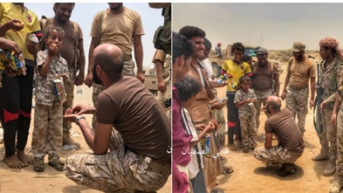 نقاش بين ضابط سعودي في حجة مع طفل اجبرته المليشيا ارتداء زي عسكري "صورة"